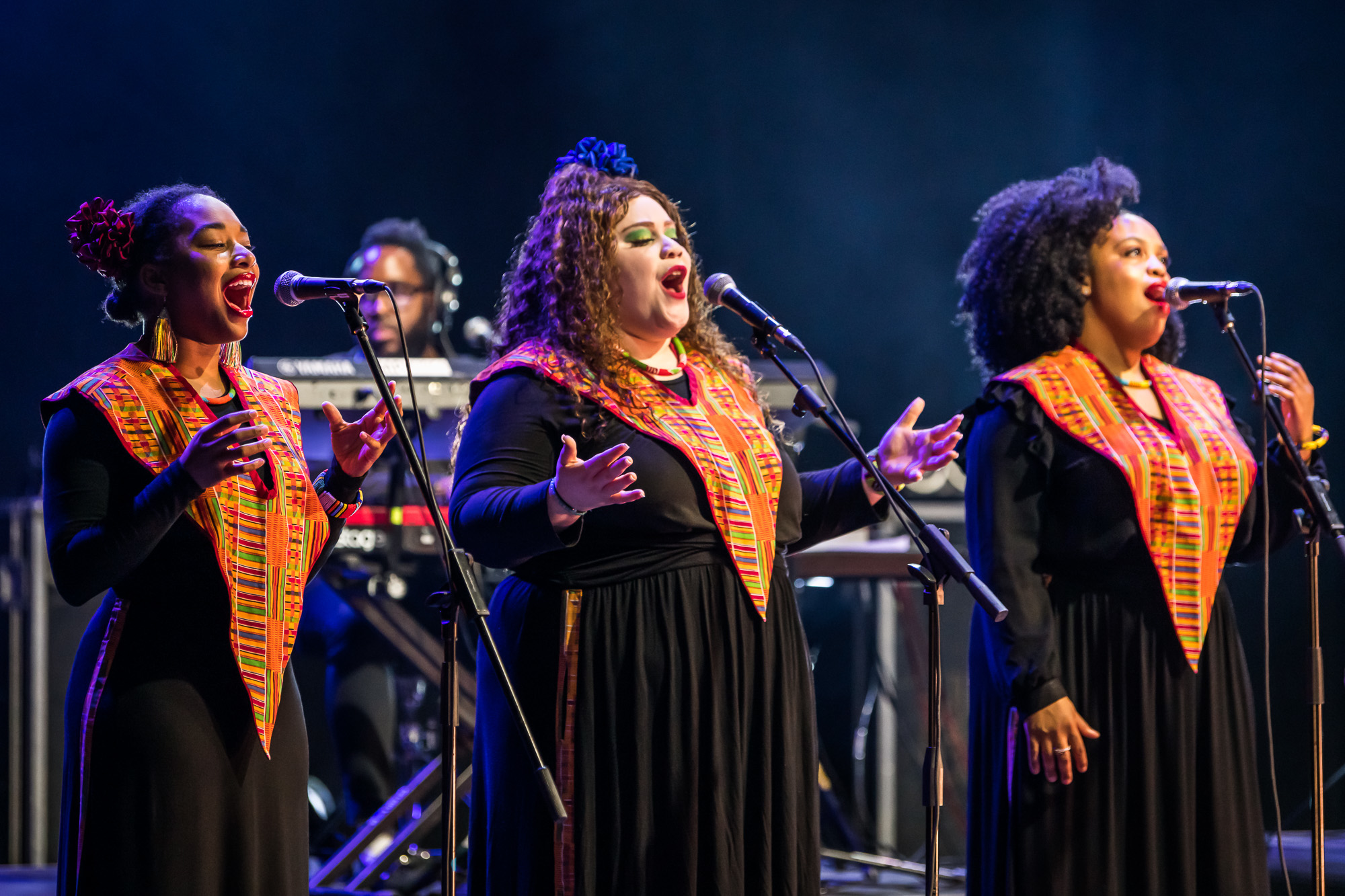 Members of the Harlem Gospel Choir sing onstage