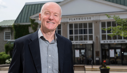 Murray Jamer standing in front of the Playhouse outside in the spring