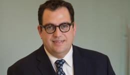 Headshot of Steven Christie wearing glasses