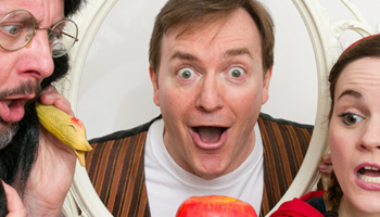 A close crop of 3 actors dressed up as different fairy tale characters