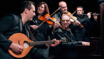 The Barra MacNeil family gathered with their instruments.