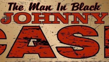 Gold Background, the words 'The Man In Black' in black font and the words 'Johnny Cash' in large red block print.