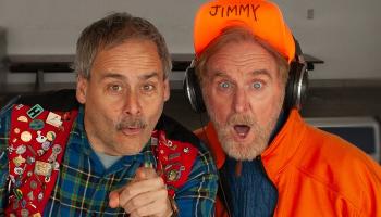 An image of Lucien and Jimmy the Janitor looking surprised. Lucien is pointing at the camera.