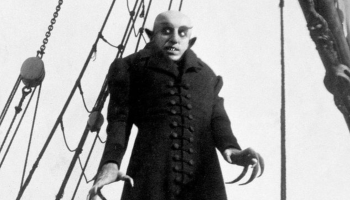 A black and white image of the vampire monster from the 1922 film, Nosferatu