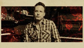 An image of Dallas Smith centered on a beige background. The words, 'Dallas Smith' are on the left side of the banner and the words, '& His band Unplugged' are on the right side of the banner in black lettering.