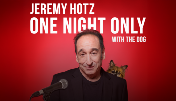 An image of Jeremy Hotz with his dog peeking out over his shoulder with a red background. The words, 'Jeremy Hotz One Night Only With His Dog' in white lettering above Jeremy.