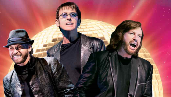 An image of 3 people dressed up as the Bee Gees over golden disco ball and a pink and purple background.