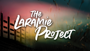 The words, 'The Laramie Project' in white lettering over a black, pink and yellow background.