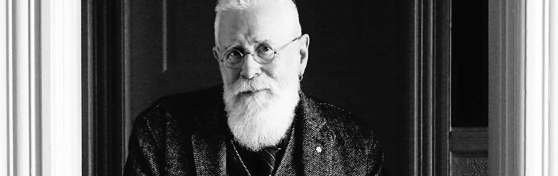 A black and white image of Bruce Cockburn.