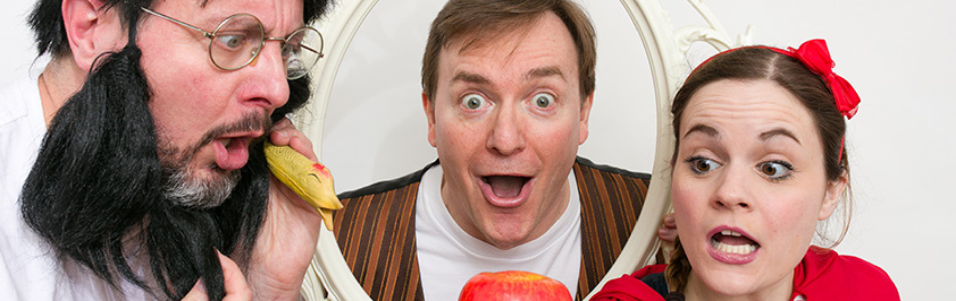 A close crop of 3 actors dressed up as different fairy tale characters