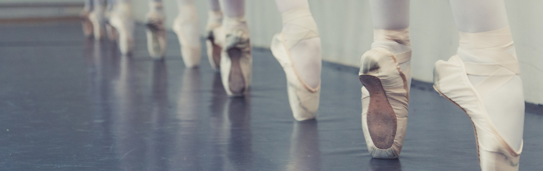 An image of ballerina feet on pointe.
