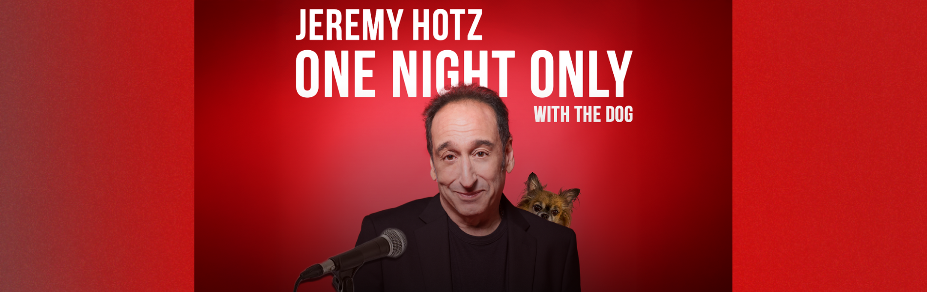 An image of Jeremy Hotz with his dog peeking out over his shoulder with a red background. The words, 'Jeremy Hotz One Night Only With His Dog' in white lettering above Jeremy.