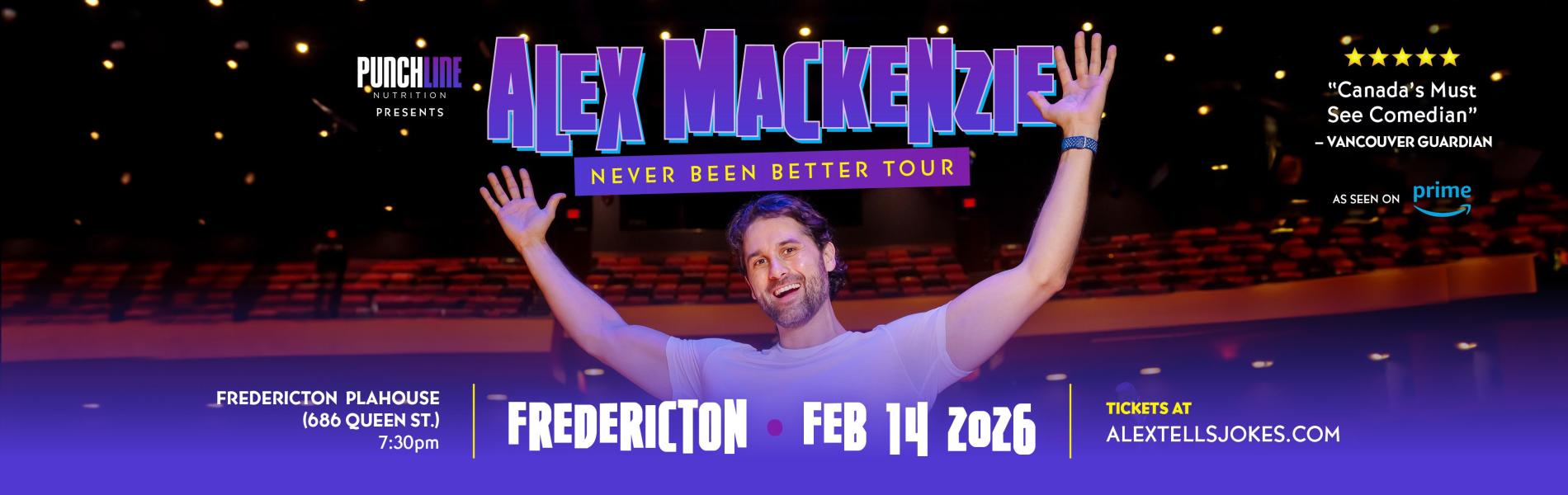 Alex Mackenzie standing on stage with his back to the auditorium. The words, 'Alex Mackenzie Fredericton February 14, 2026' in purple and white lettering.