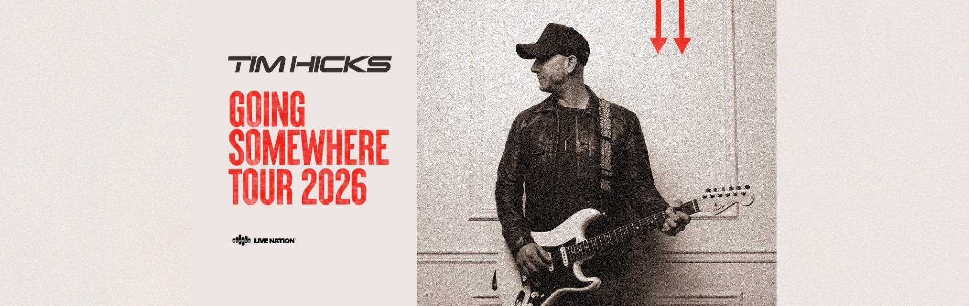 An image of Tim Hicks leaning against a wall holding his guitar, face turned to his right. The words, 'Tim Hicks Going Somewhere Tour 2026' in black and red over a pale cream background..