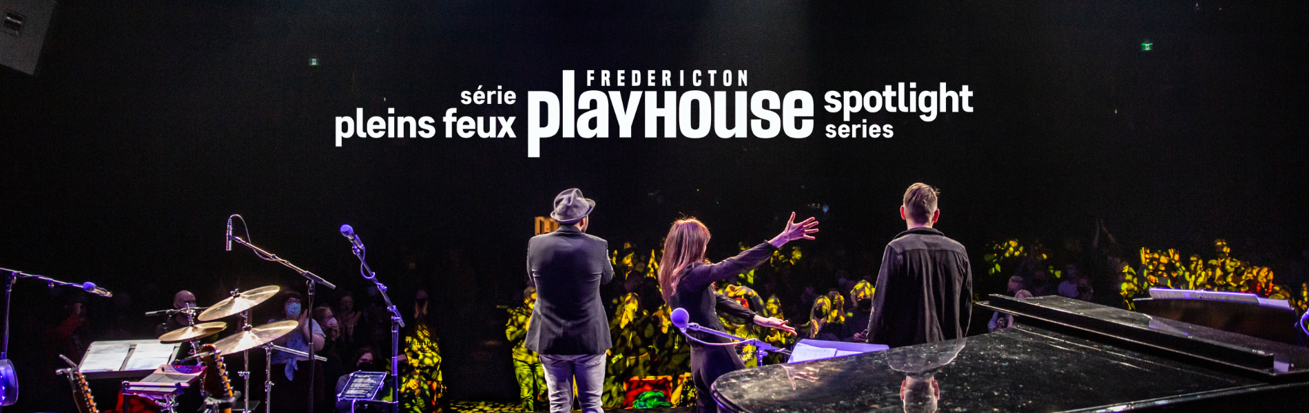 The Playhouse stage with several musicians facing the audience. 