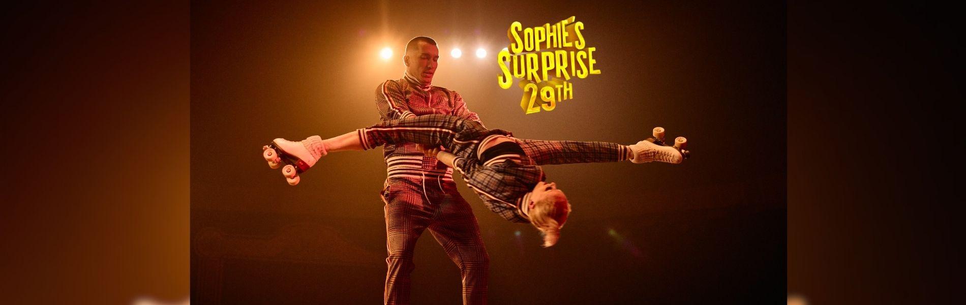 Two acrobats hold each other in a fun pose.